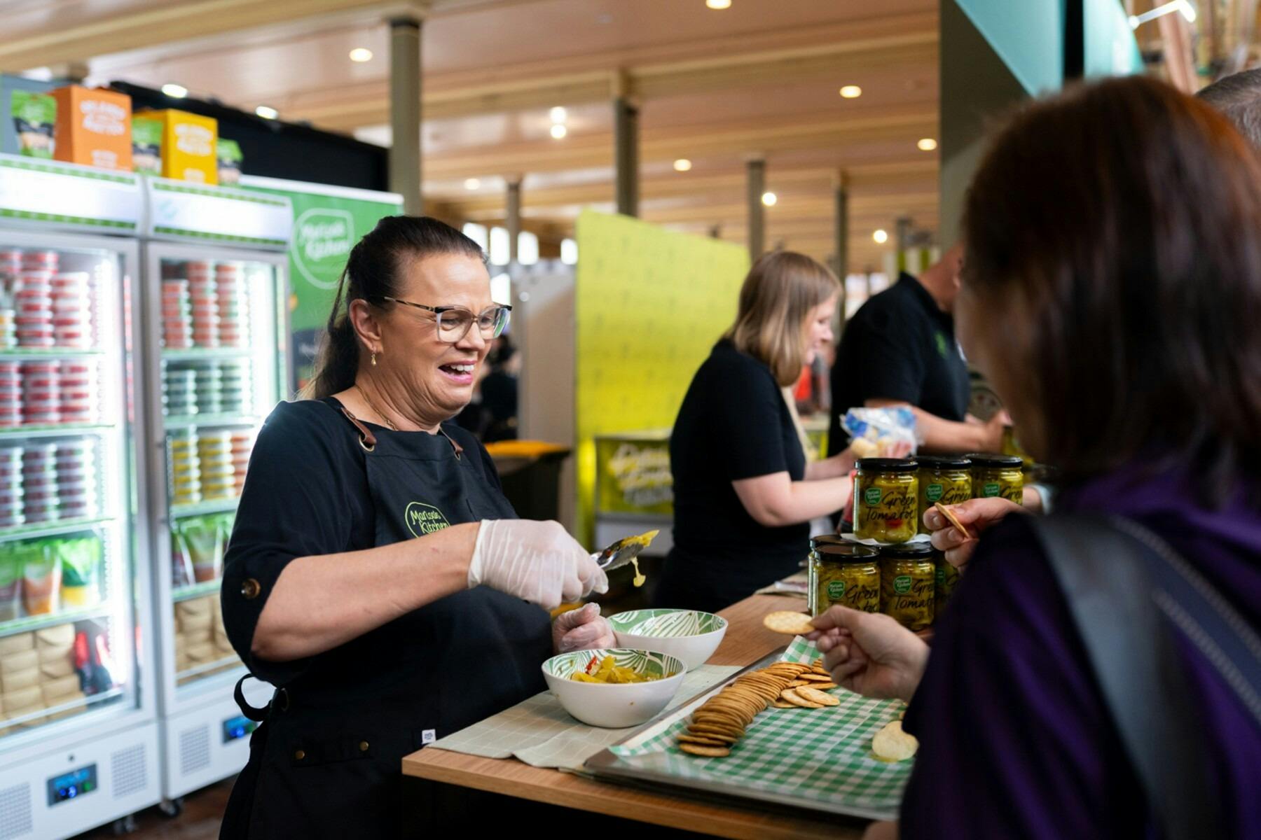 Visitors meet local exhibitors and sample quality Italian food products.