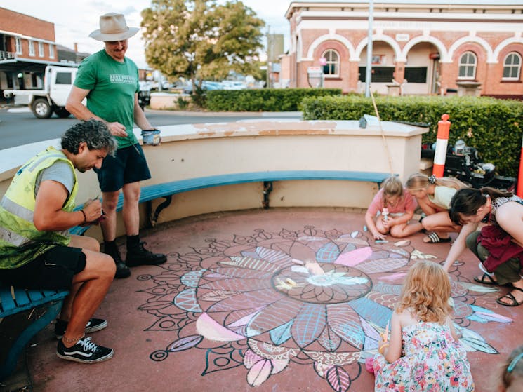 Children colouring at a chalk workshop