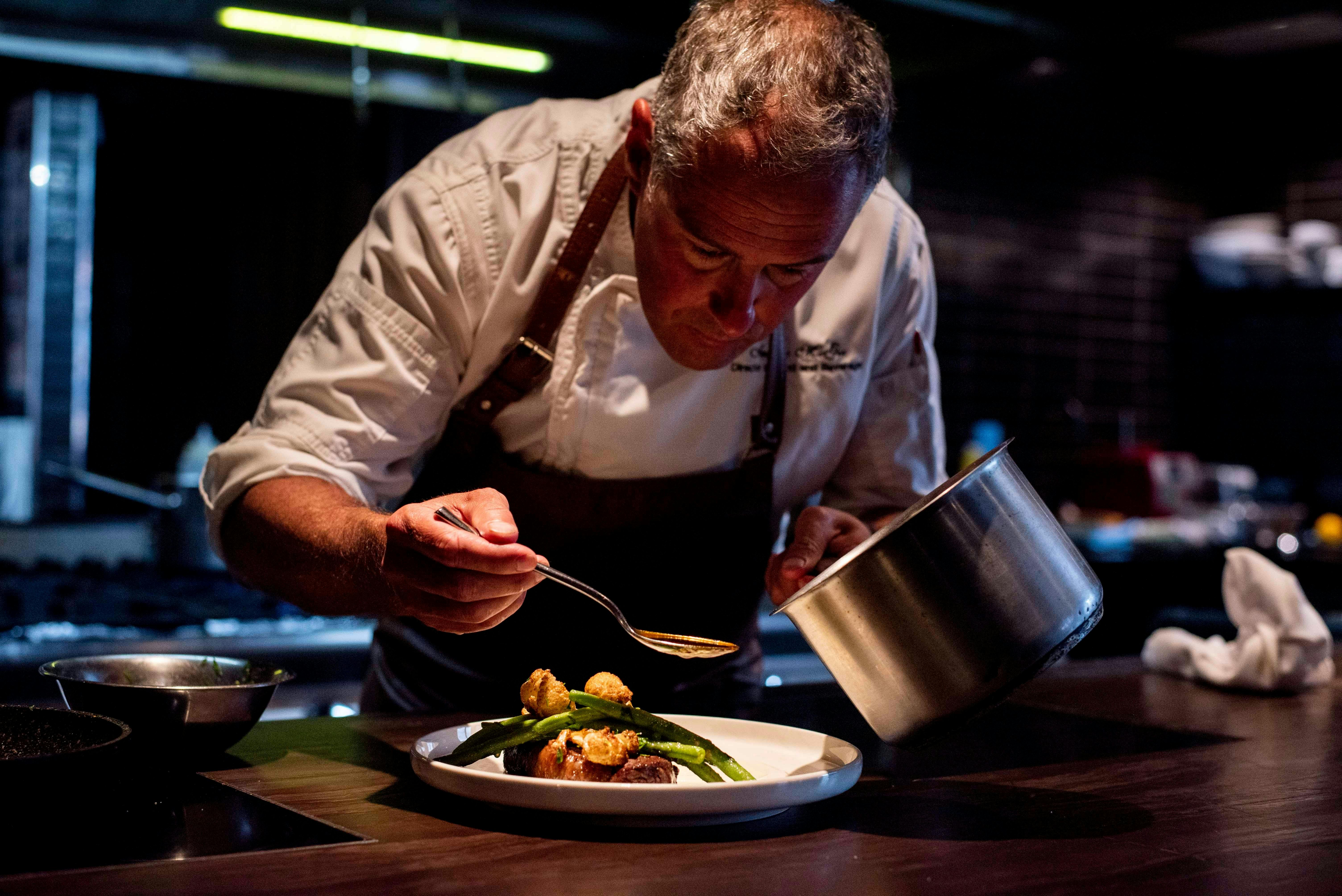 A chef plating a dish
