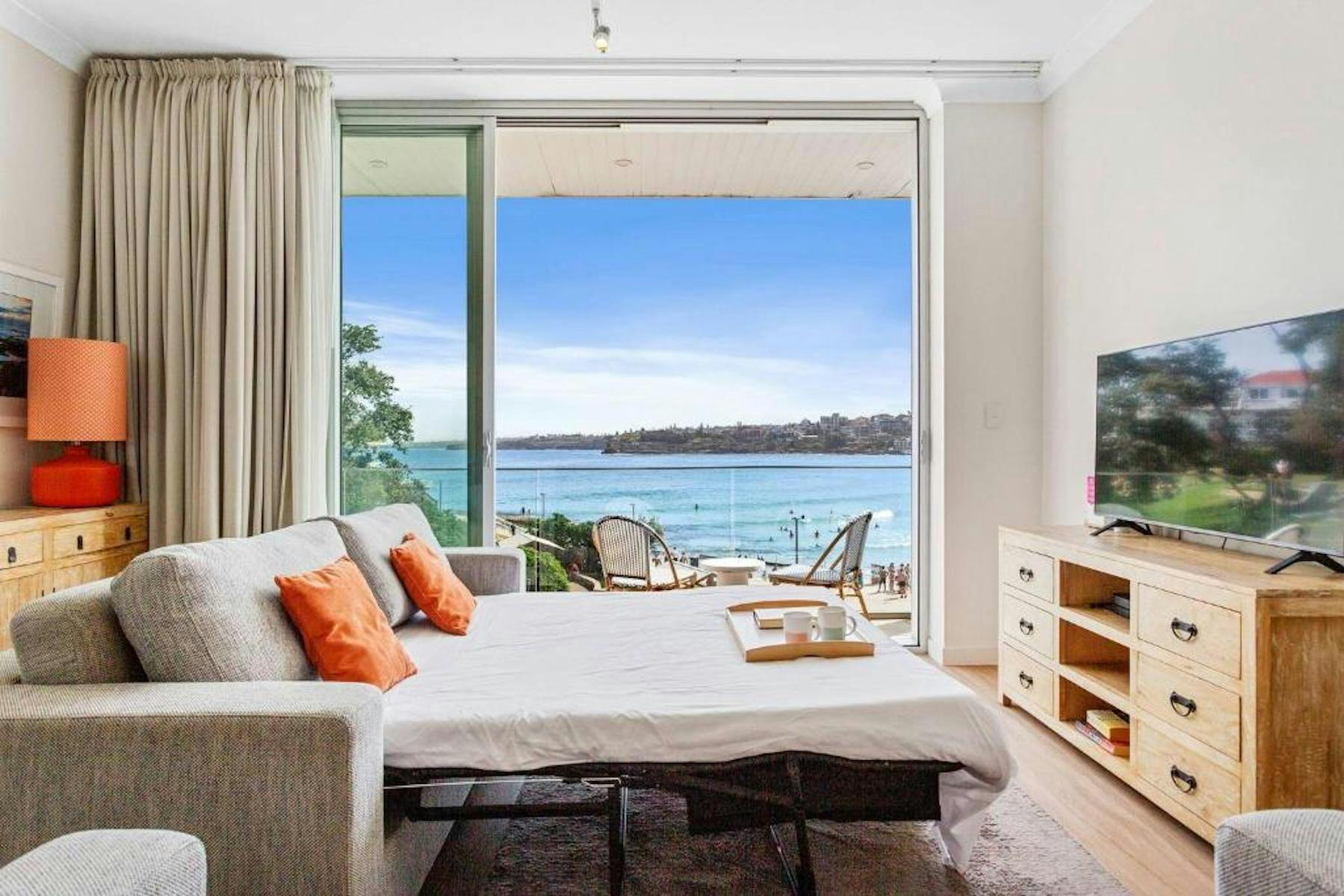Double sized sofa bed for extra sleepers.  Sheer and block out curtains.