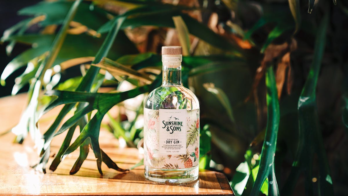 A bottle of our Original Dry Gin surrounded by leaves