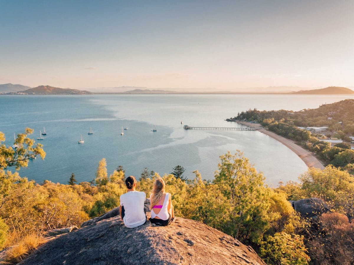 Two people looking out over a body of water