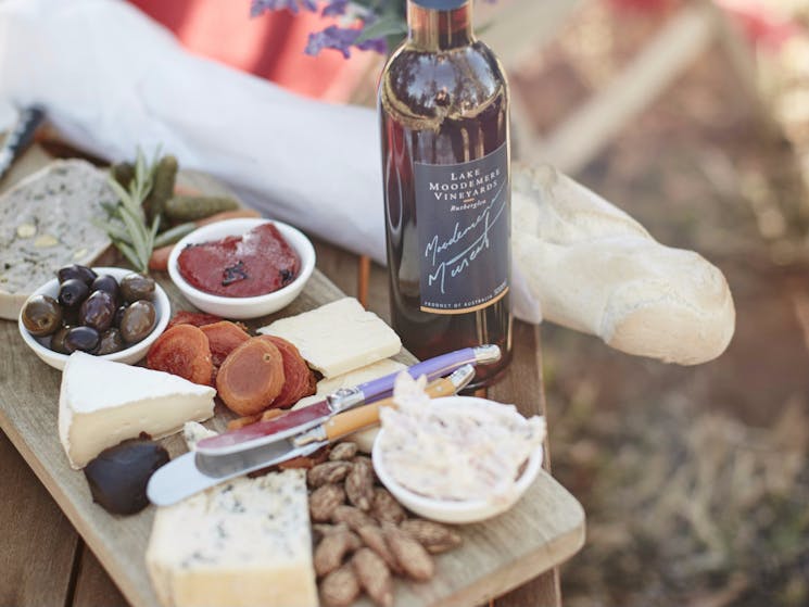 Platter with olives, cheese served with Muscat