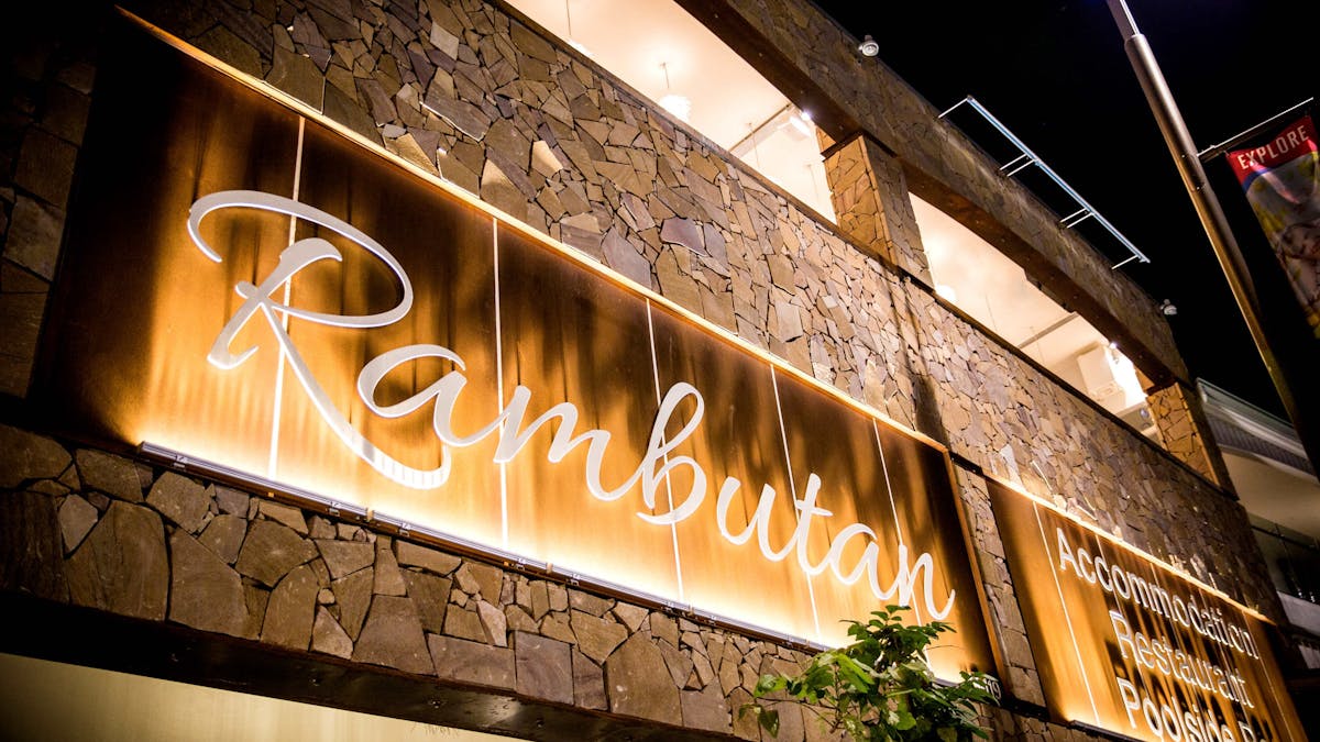 Rambutan's entrance facade with signage