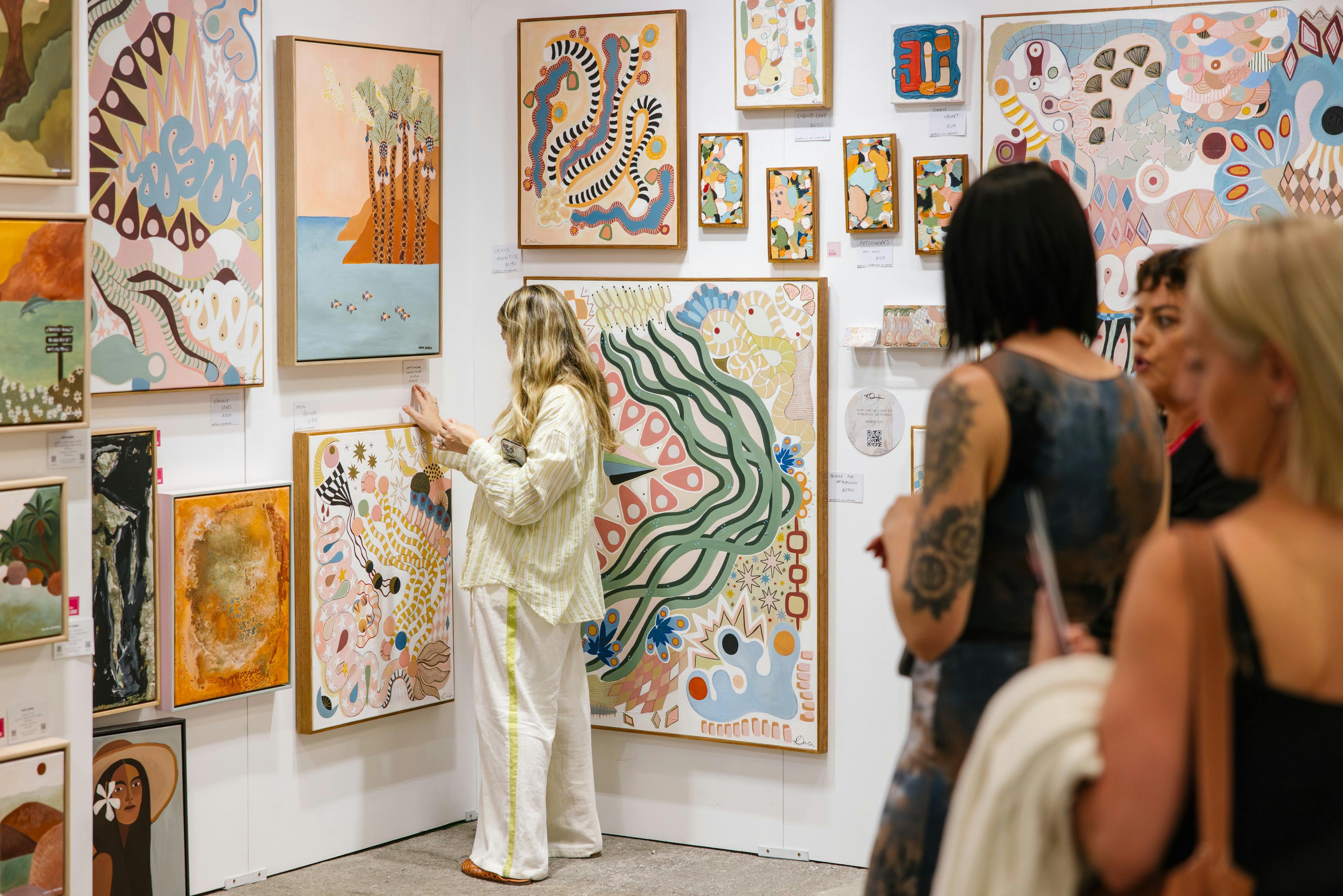 People viewing artworks