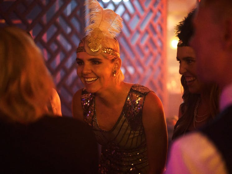 Gatsby party flapper girl enjoys burlesque comedy cabaret in Sydney's Bamboozle Room