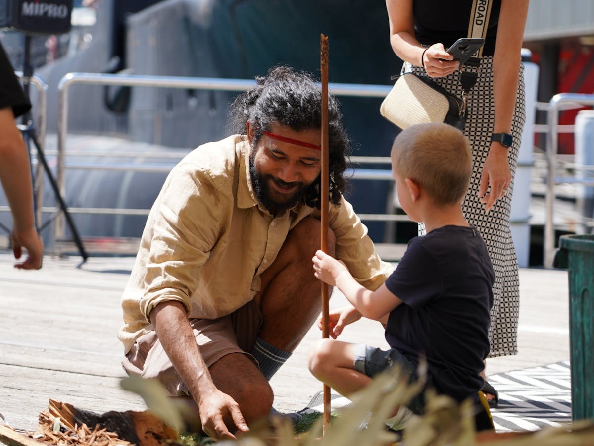 A person and child participating in a nawi building workshop