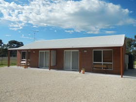 Modern brick ensuite cabins that can sleep up to 6 people with kitchen facilities, A/C & TV