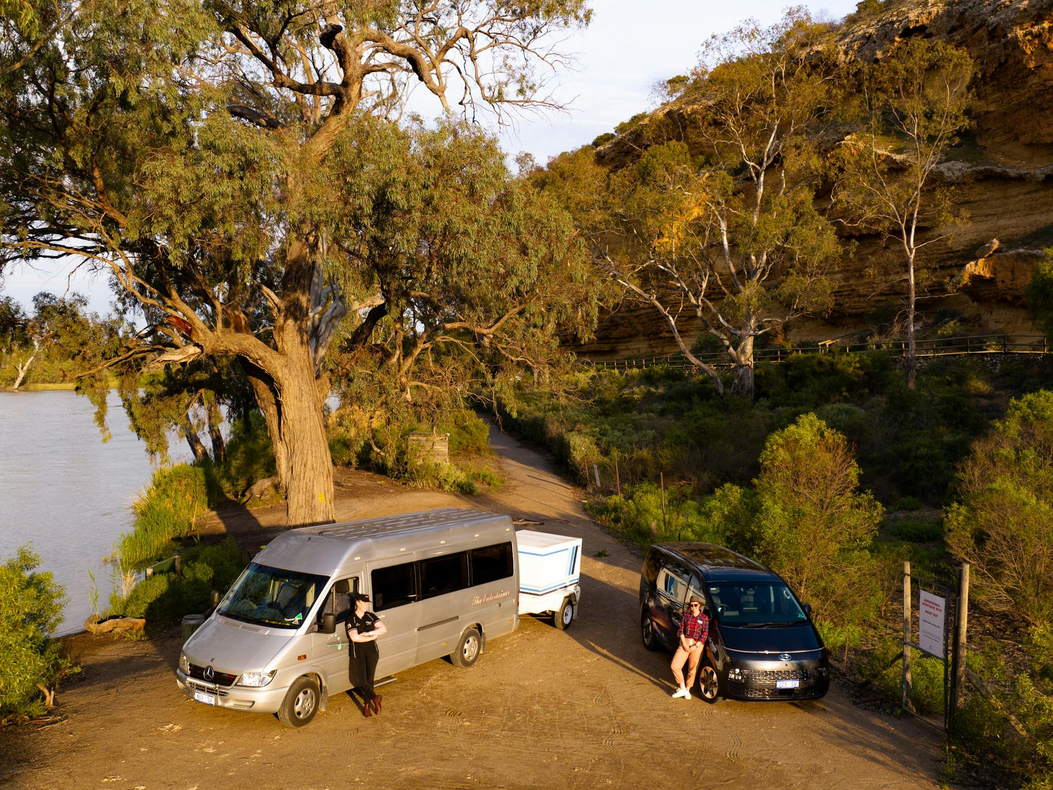 The Entertainer & Staria touring vehicles on the bank of the River Murray