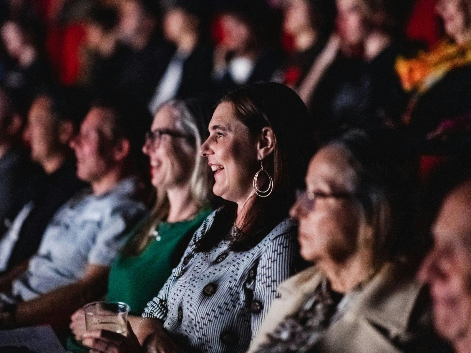 Audience seated in a cinema during a Very Short Film Festival screening.