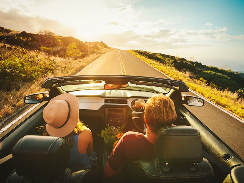 Couple driving a convertible