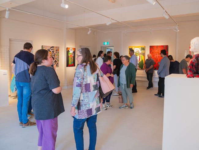 People standing in an art gallery