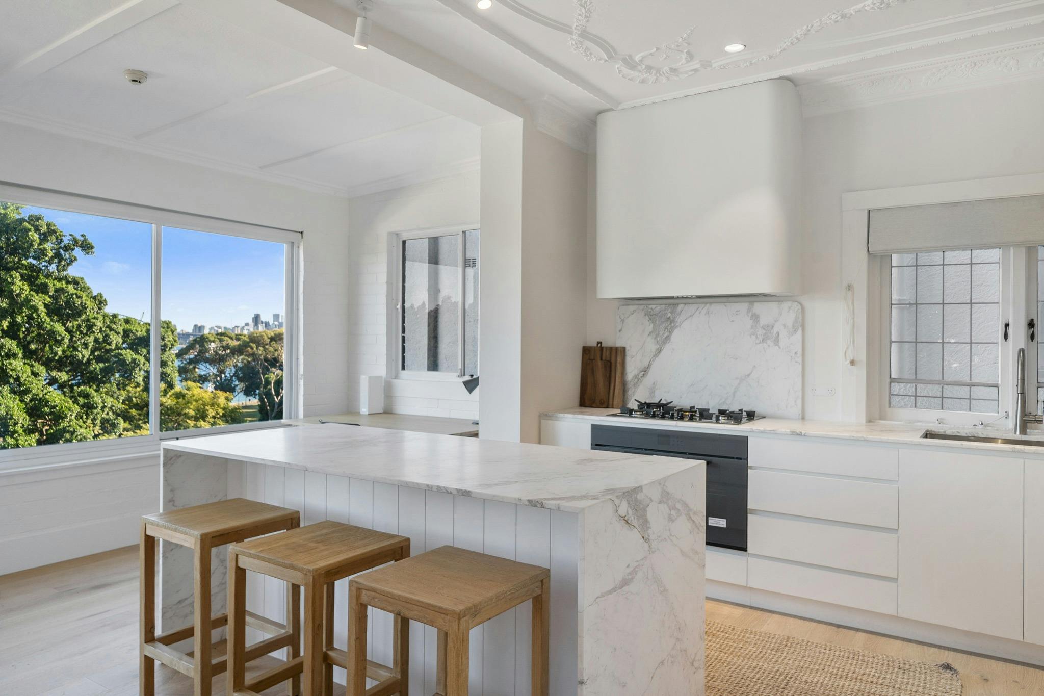 Stylish kitchen with marble counters and stunning views.