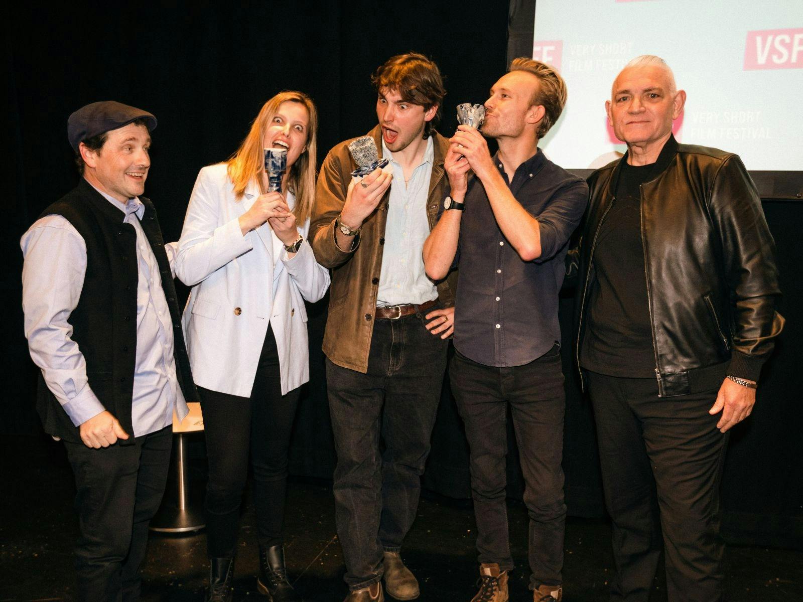 Very Short Film Festival winners holding Dorothy award trophies.