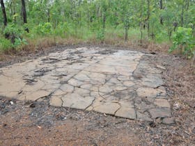 One of several floor slabs located behind the airstrip.
