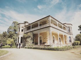 Large Victorian homestead with gravel driveway
