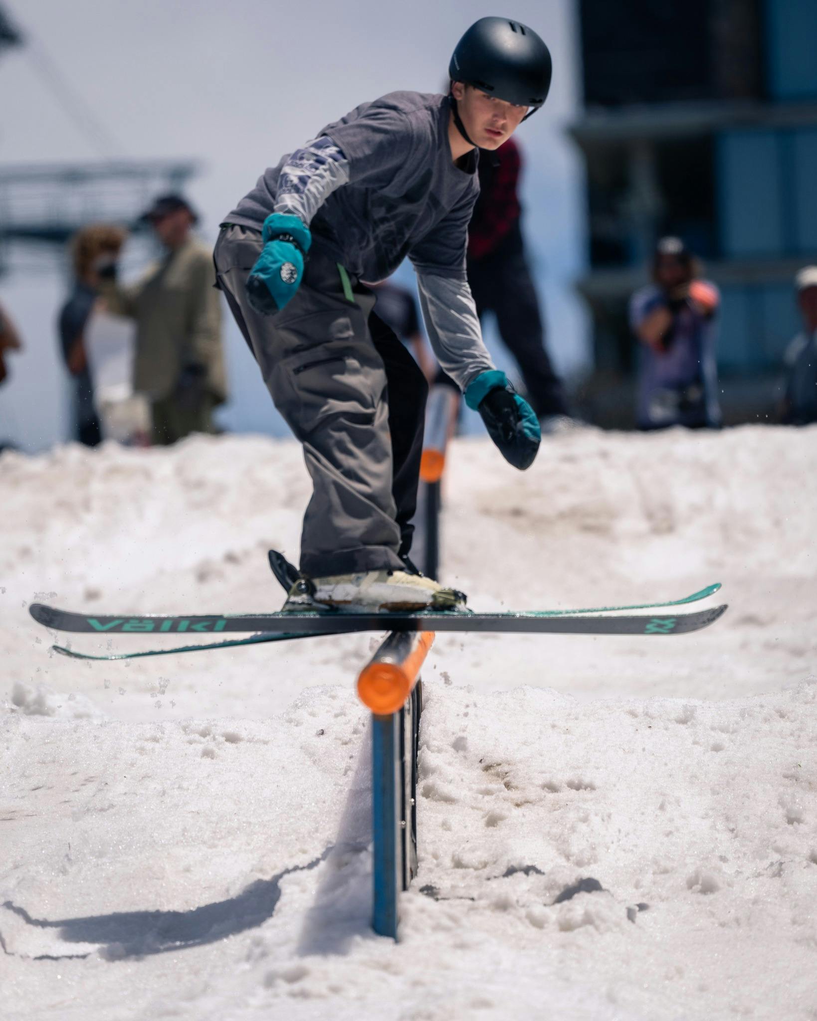 Skier going down a rail