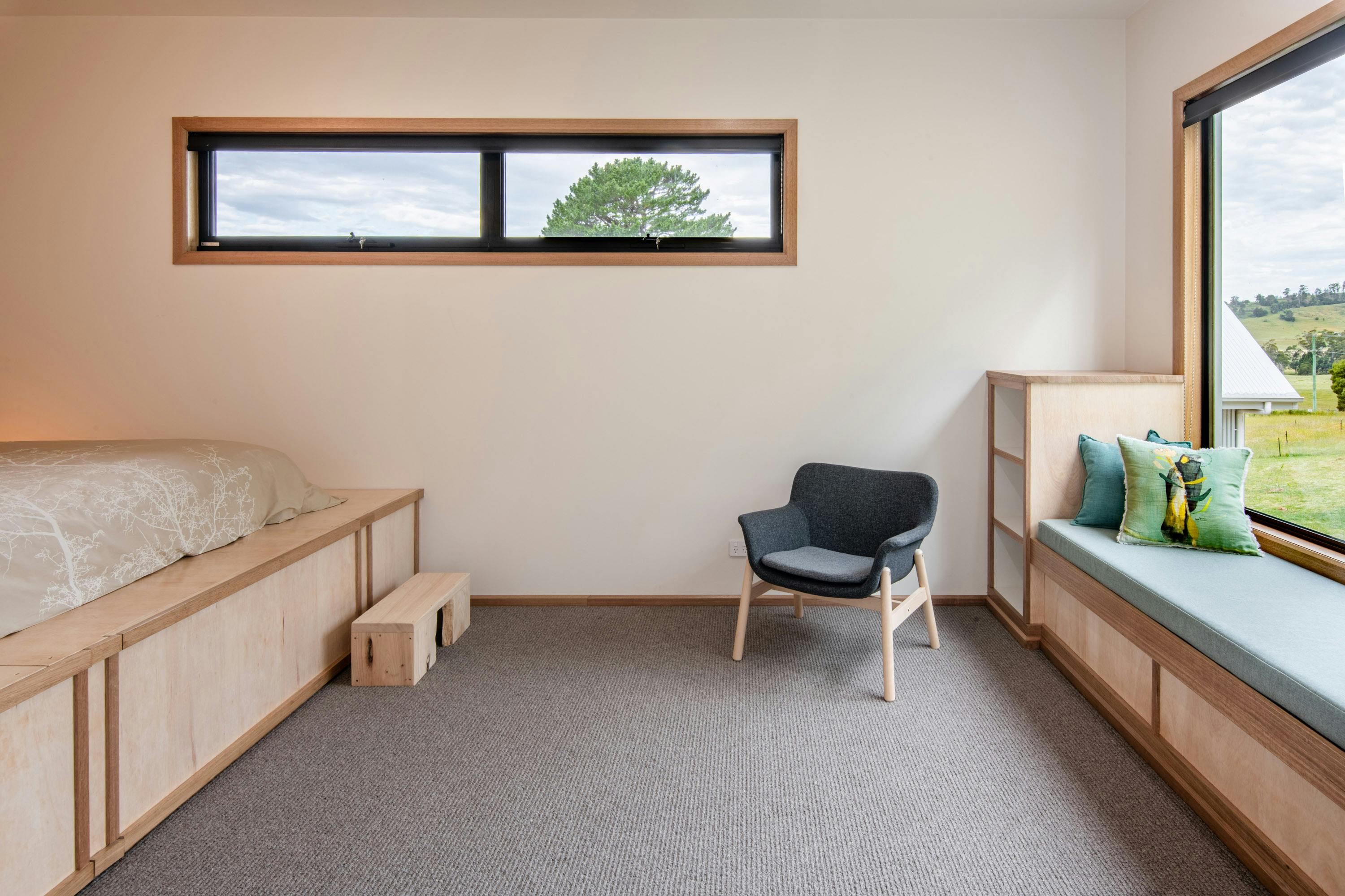 Studio space with bed on a raised platform