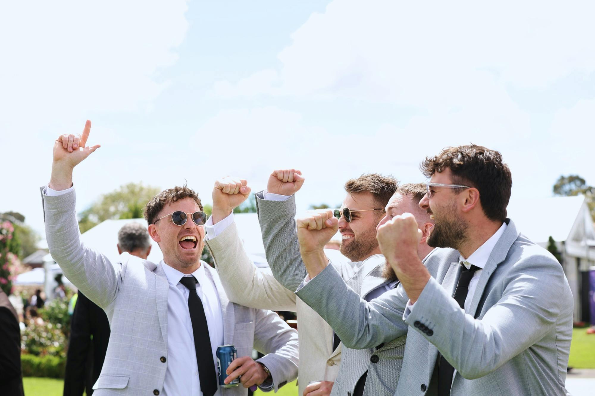 Racegoers celebrating a win