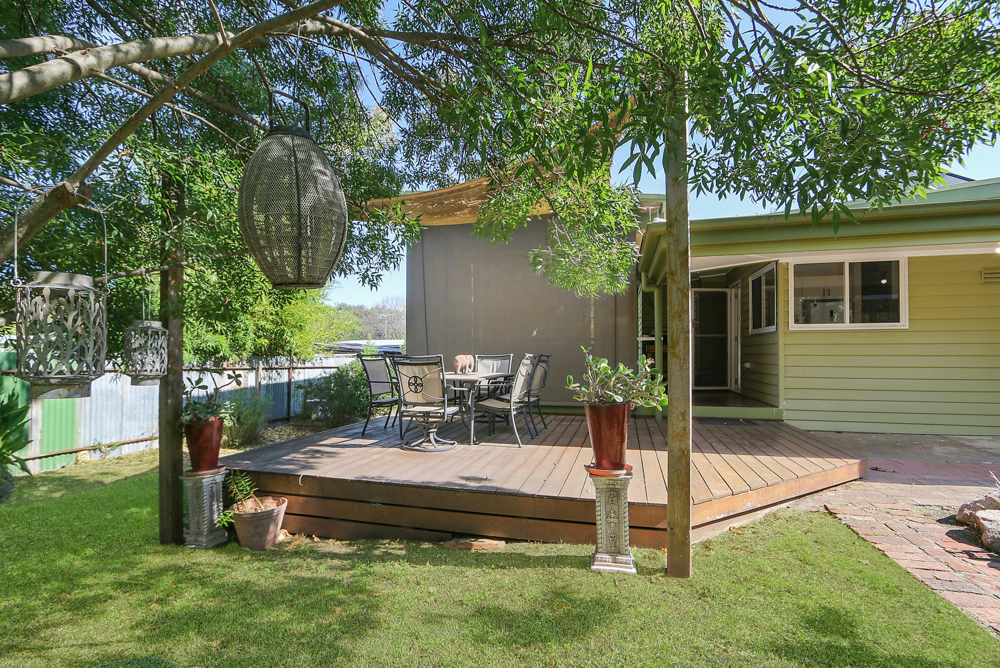 Outdoor area with dining table in a sunny setting