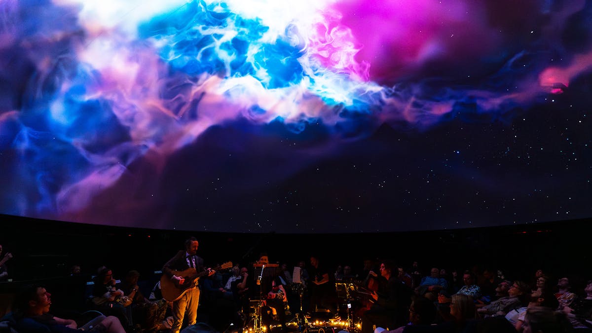 2023 album launch show. A wide shot with a nebula above