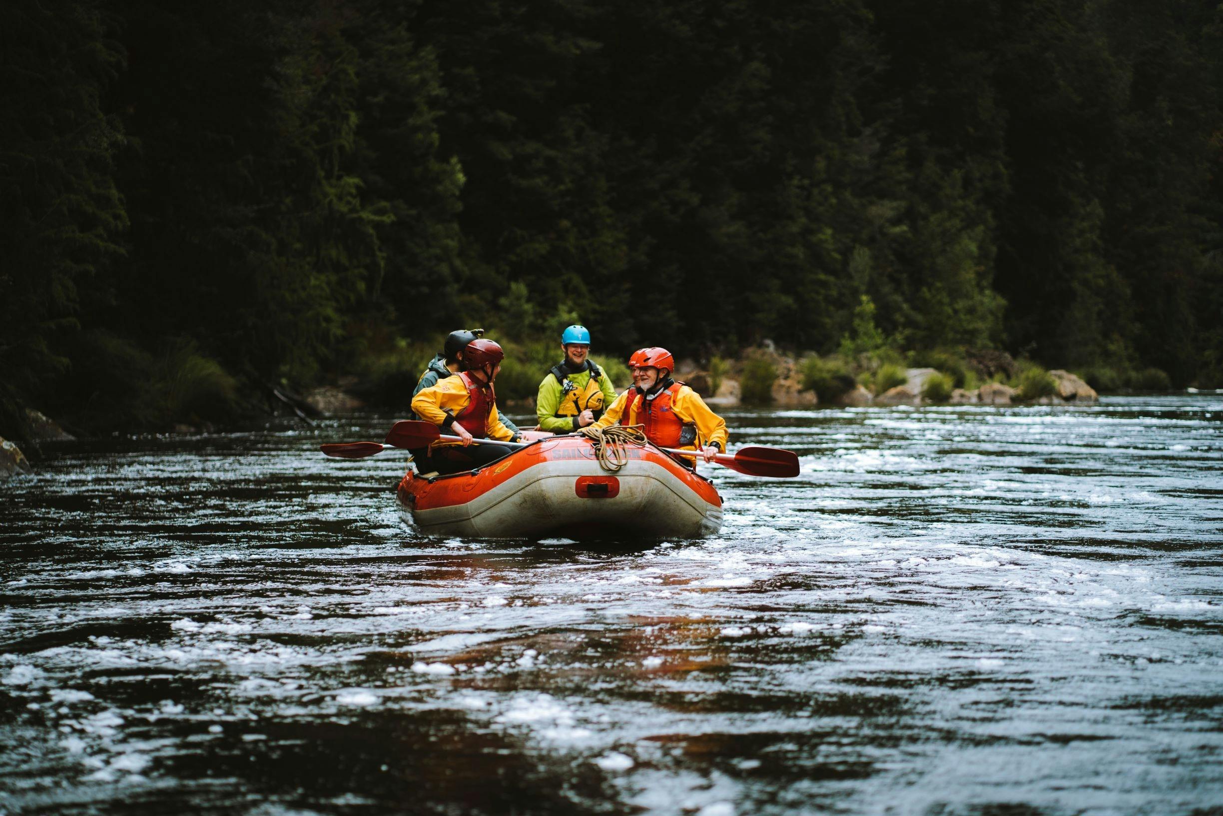 Red Raft with people on the King River Tasmania