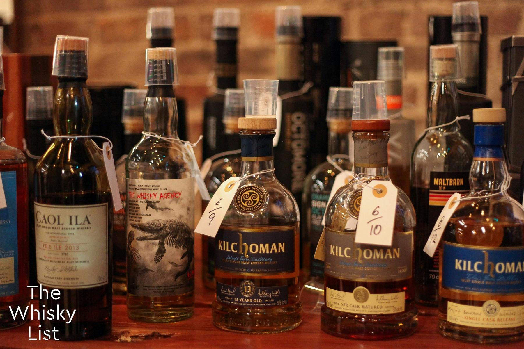 A close-up of 15 or more Islay Whiskies available to sample