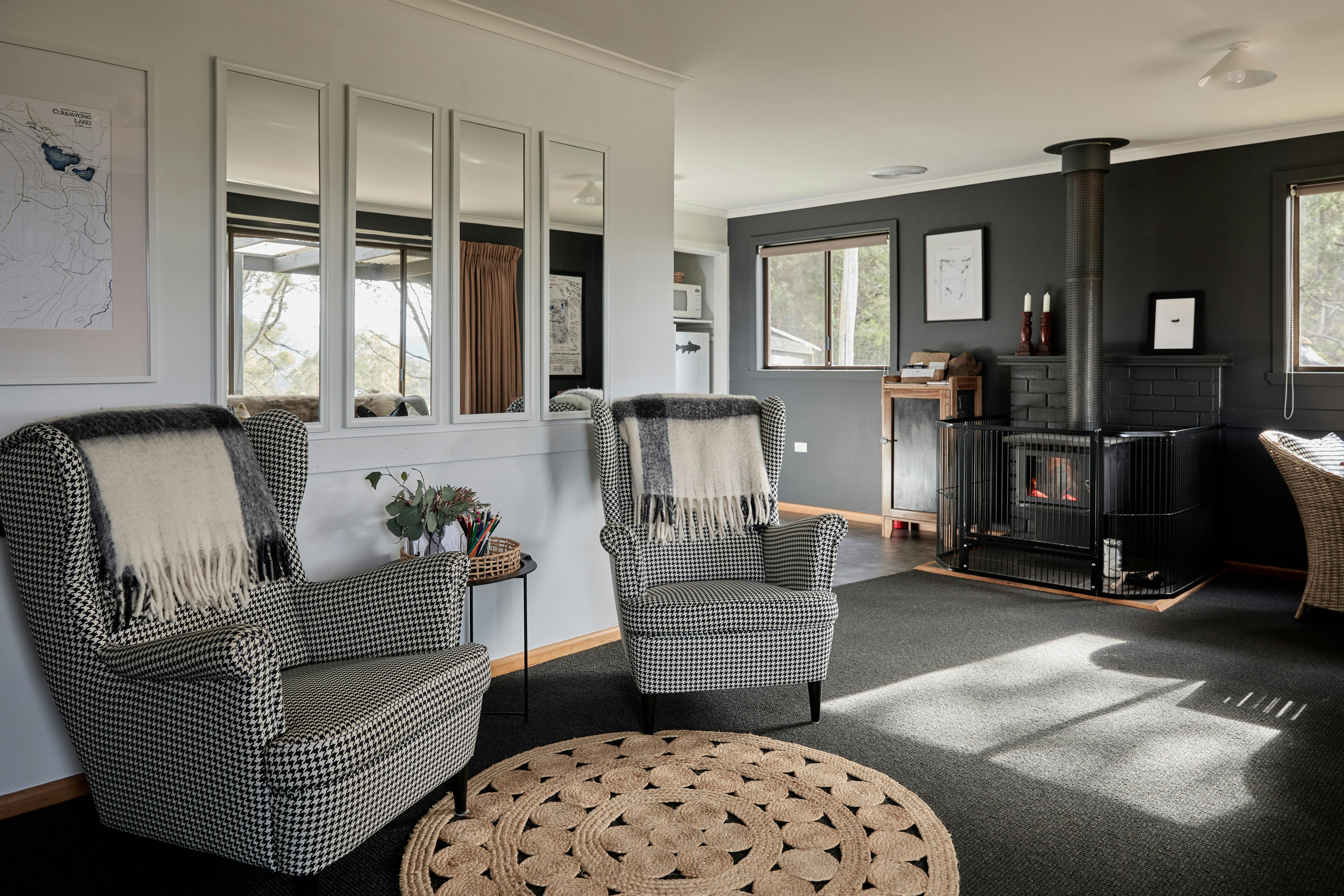 2 high back chairs in open plan lounge, dining and kitchen area