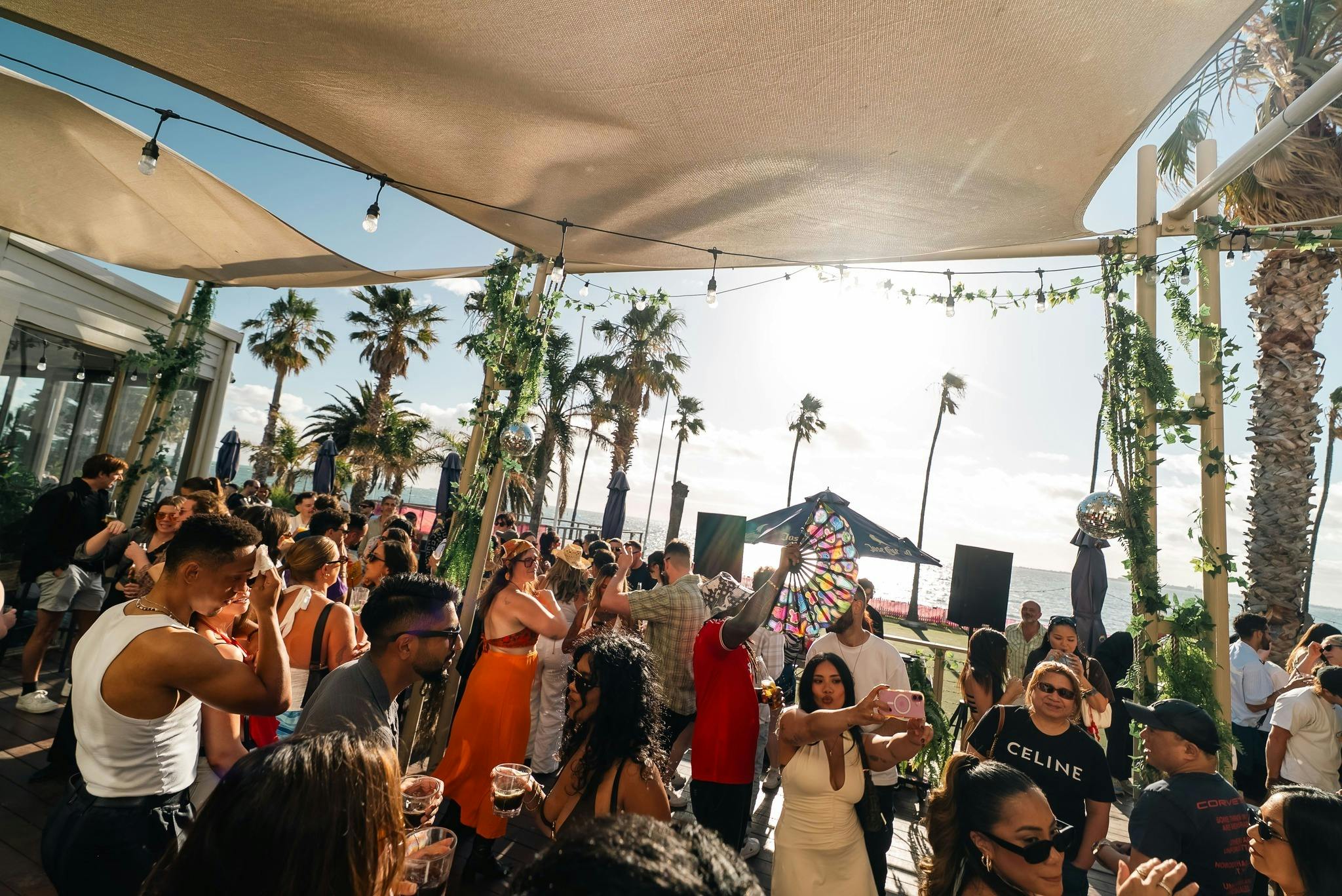 Crowd in front of sunset at Riviera Beach Club