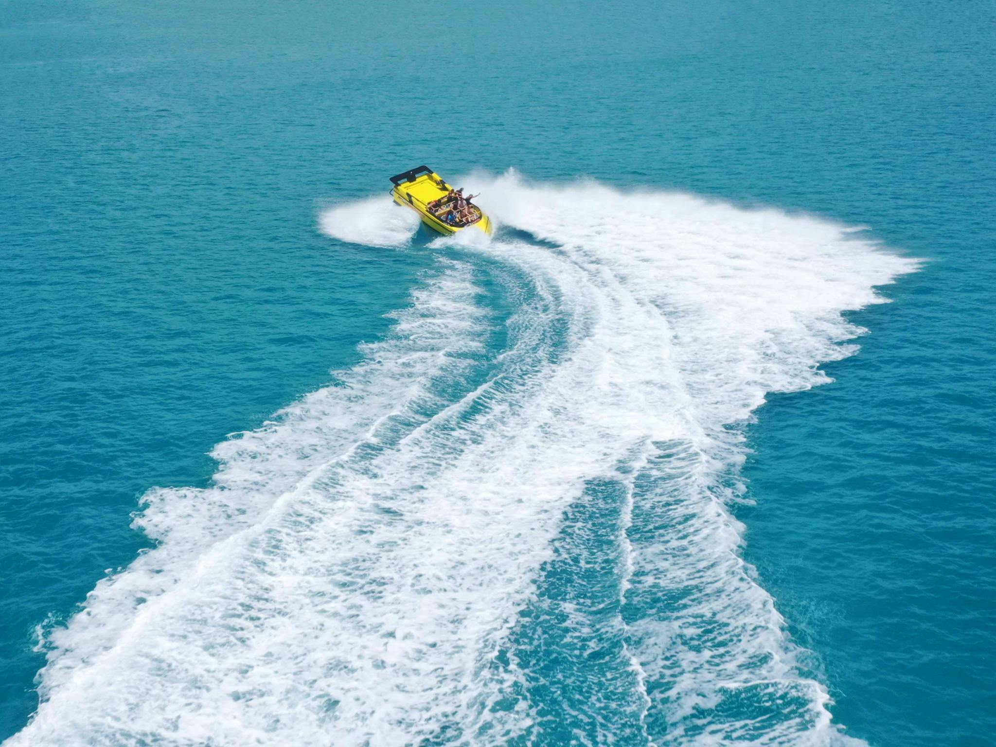 aerial image of jet boat moving at speed aerial image of jet boat moving at speed