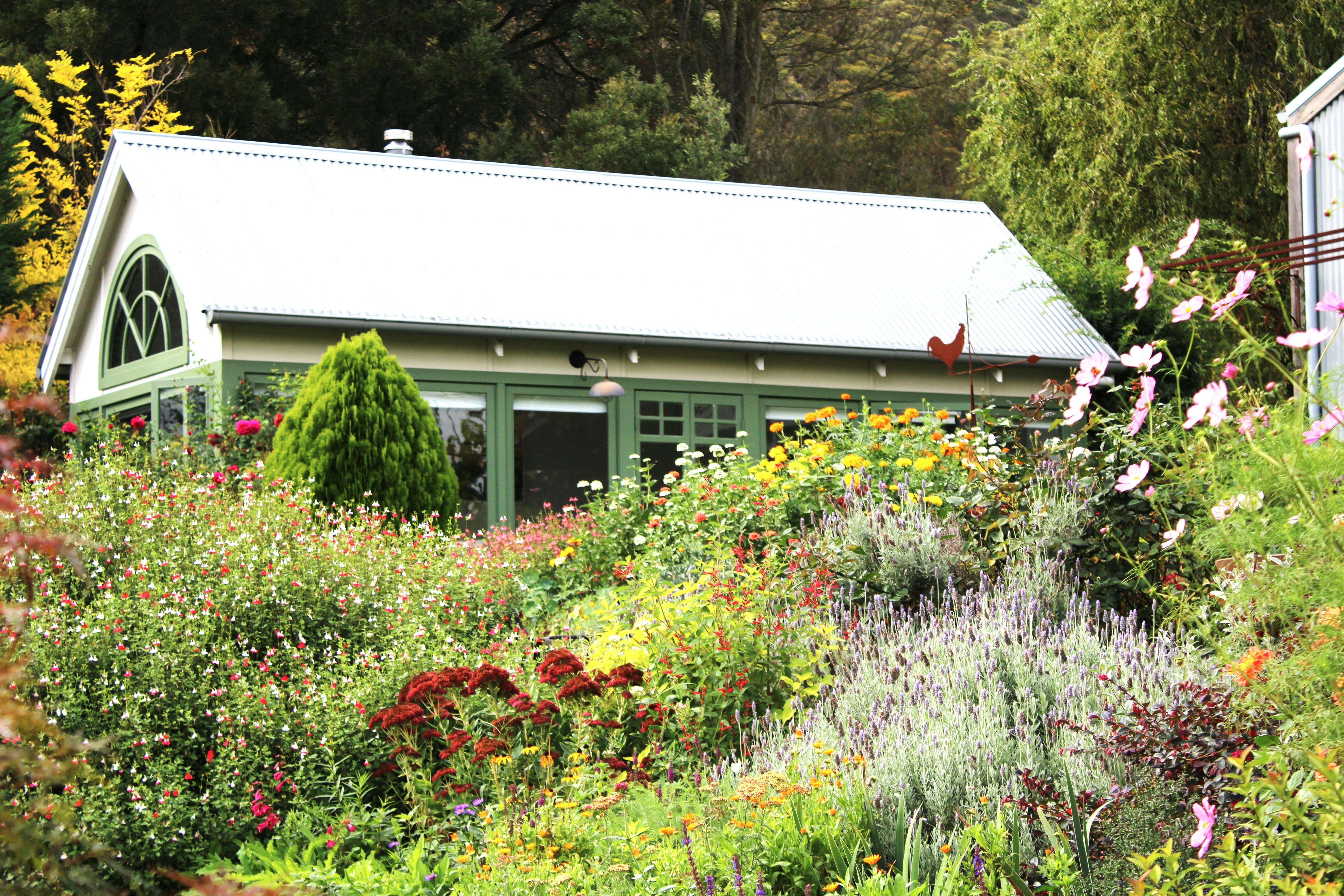 The art studio nestles in the garden