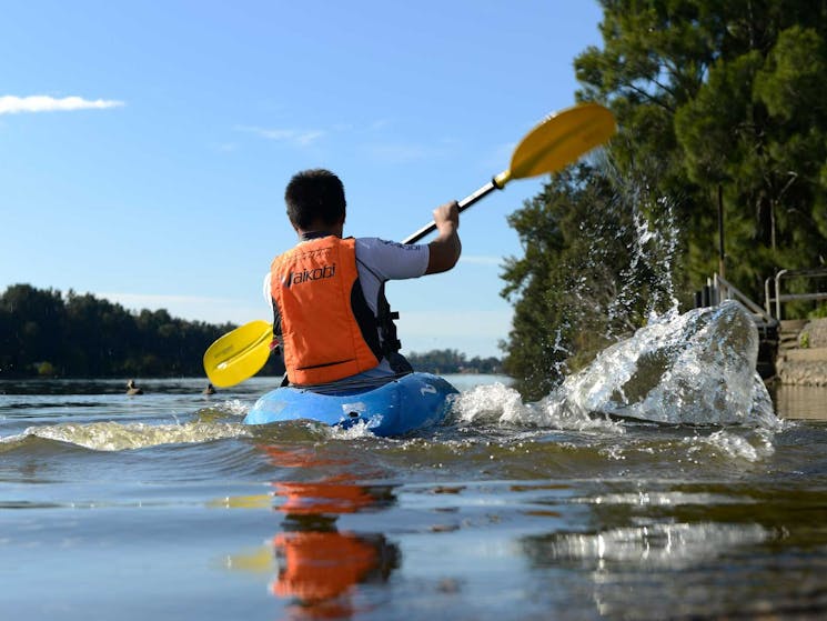 Man kayaking on river