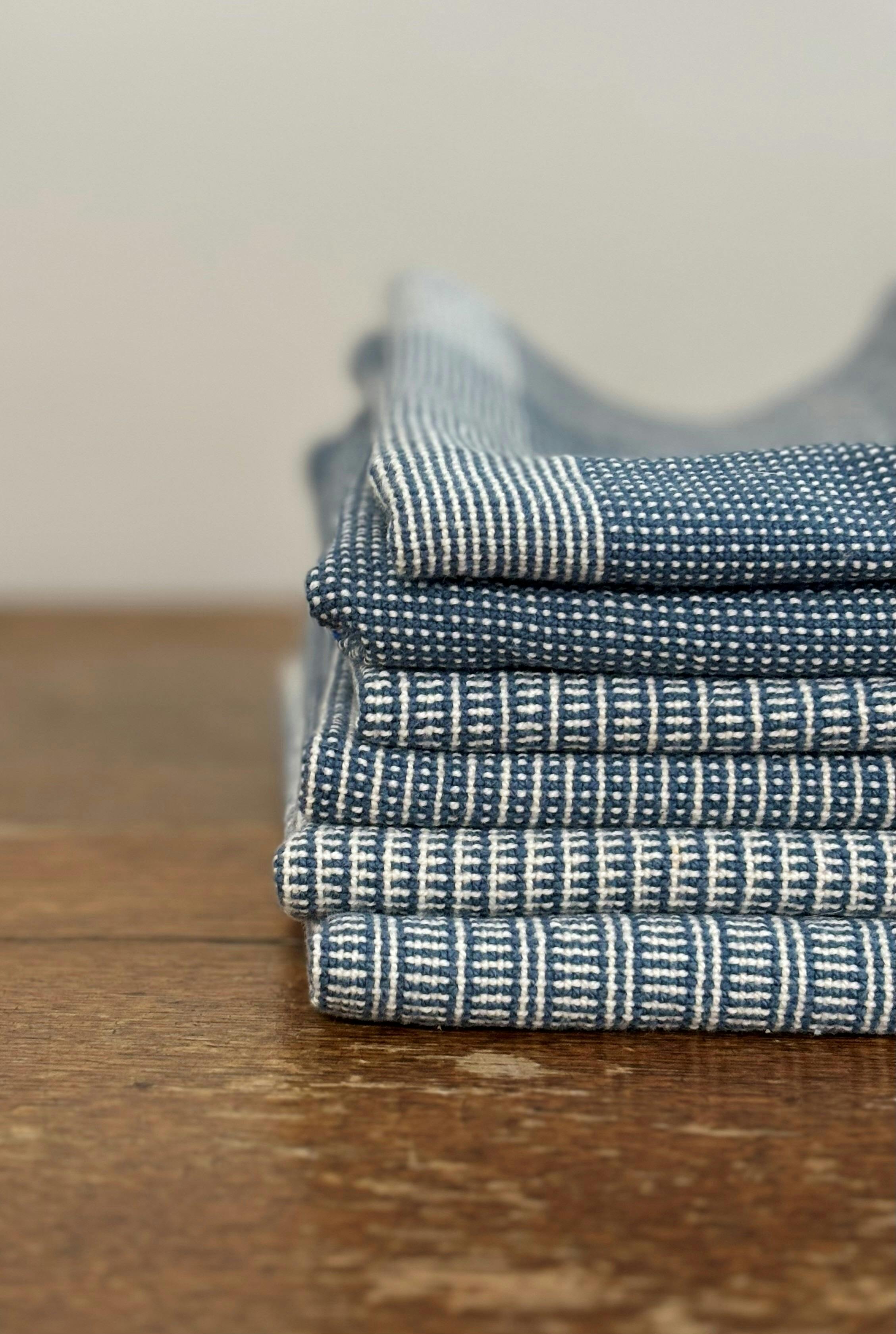 A pile of blue, woven cloth