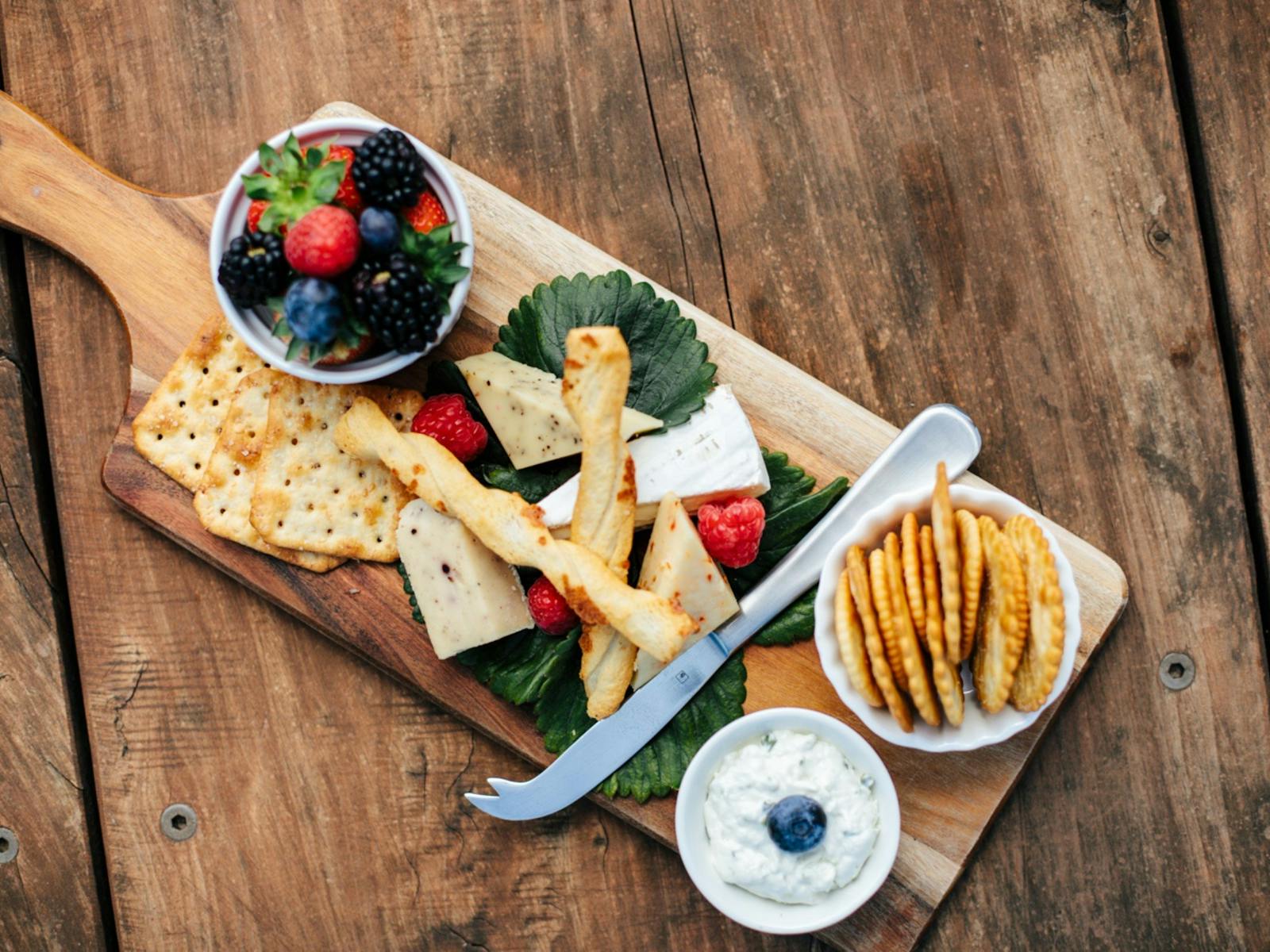 A cheese board with local cheeses and Hillwood berries.