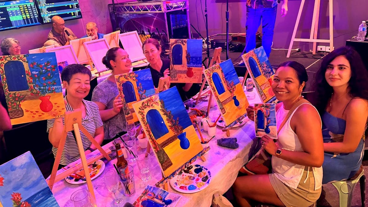 Paint Juicy host leading a full room at a mobile paint and sip event in Darwin