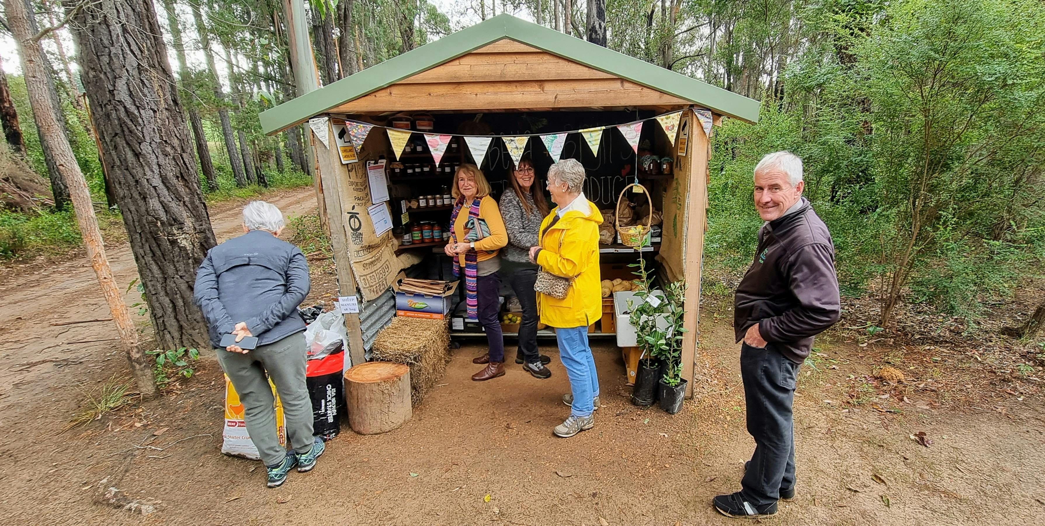 A group of people at Farm Gate Shop