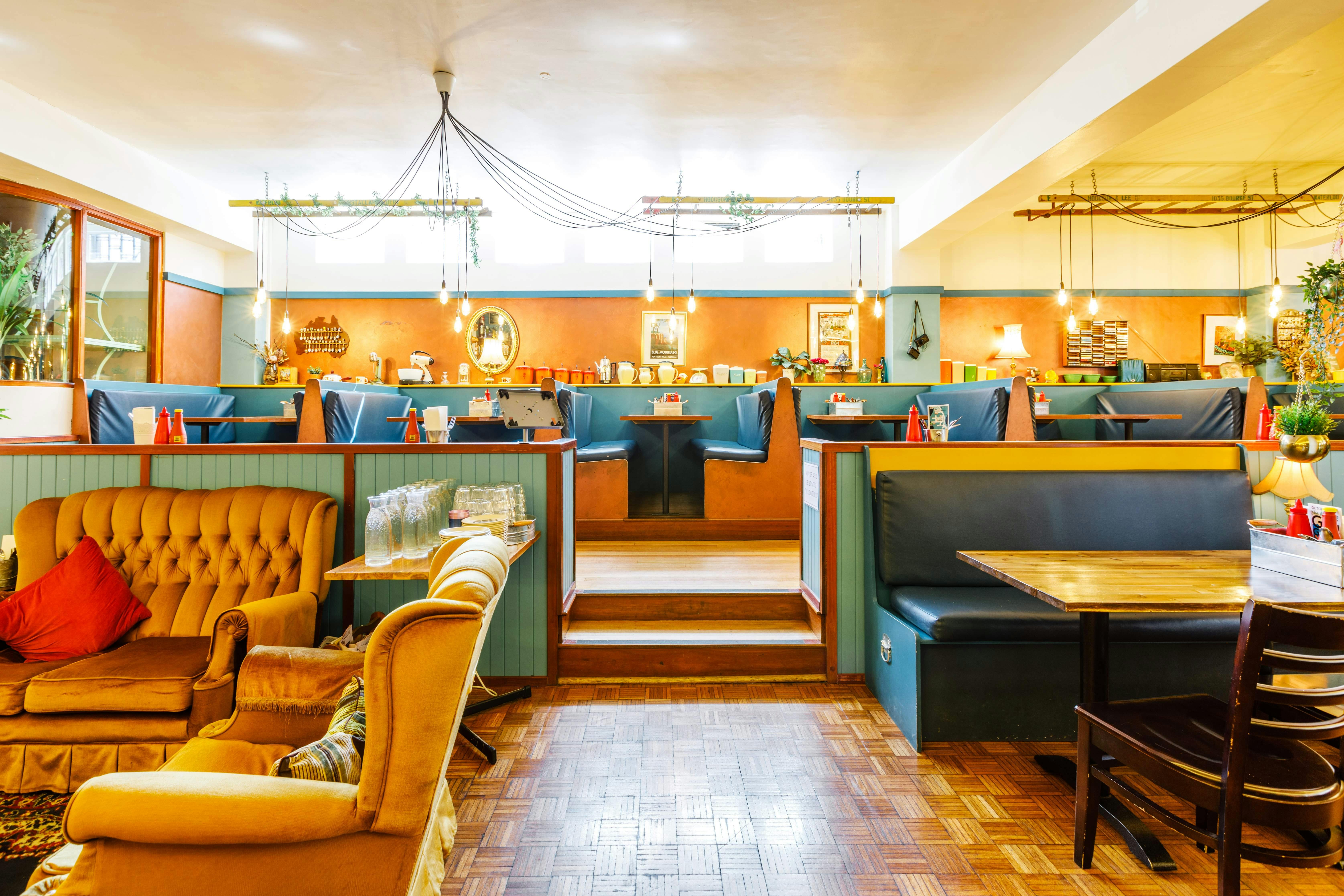 Retro diner style booths  surrounded by vintage homewares and decor