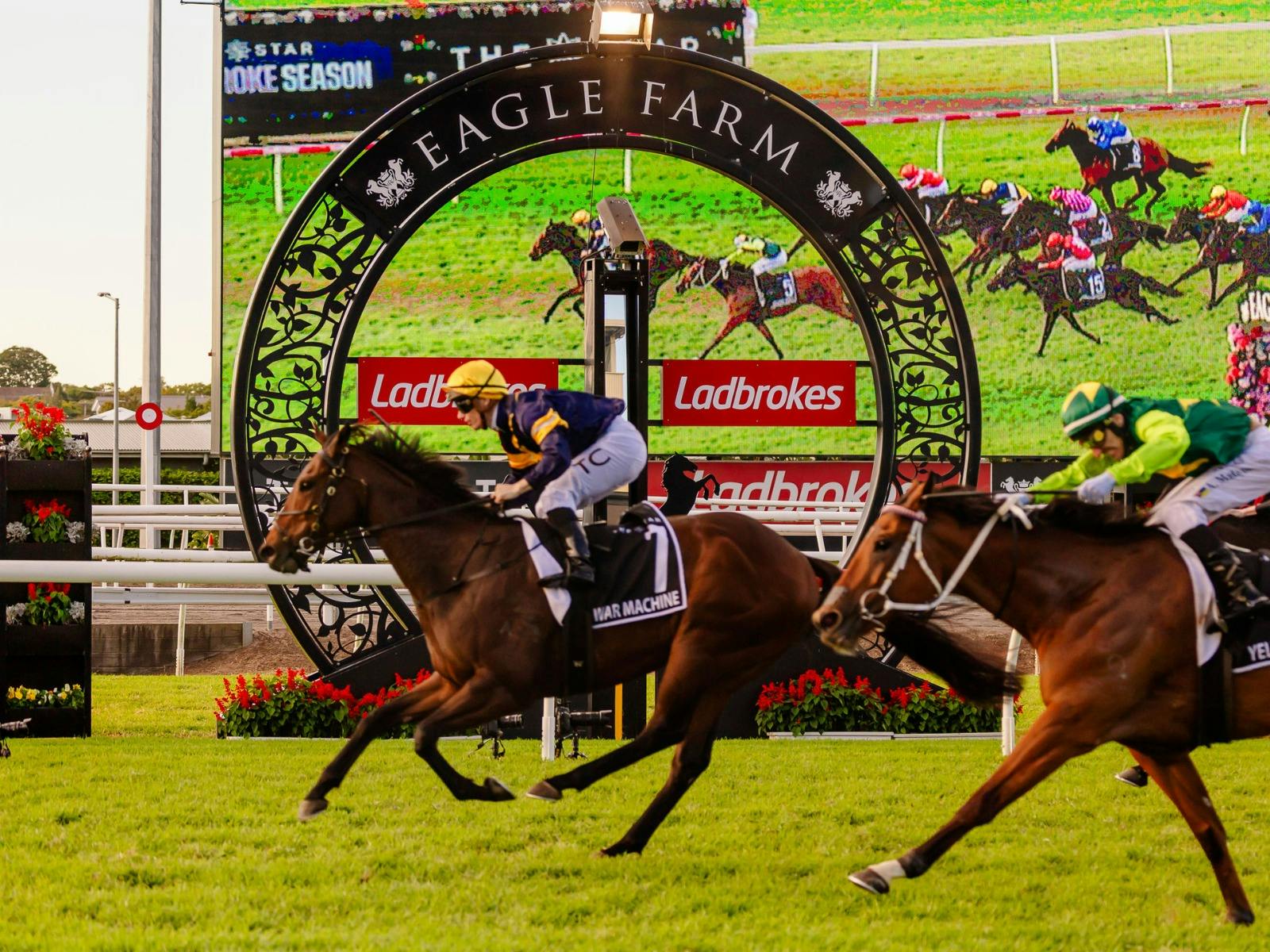 A horse running past the Eagle Farm winning post A horse running past the Eagle Farm winning post