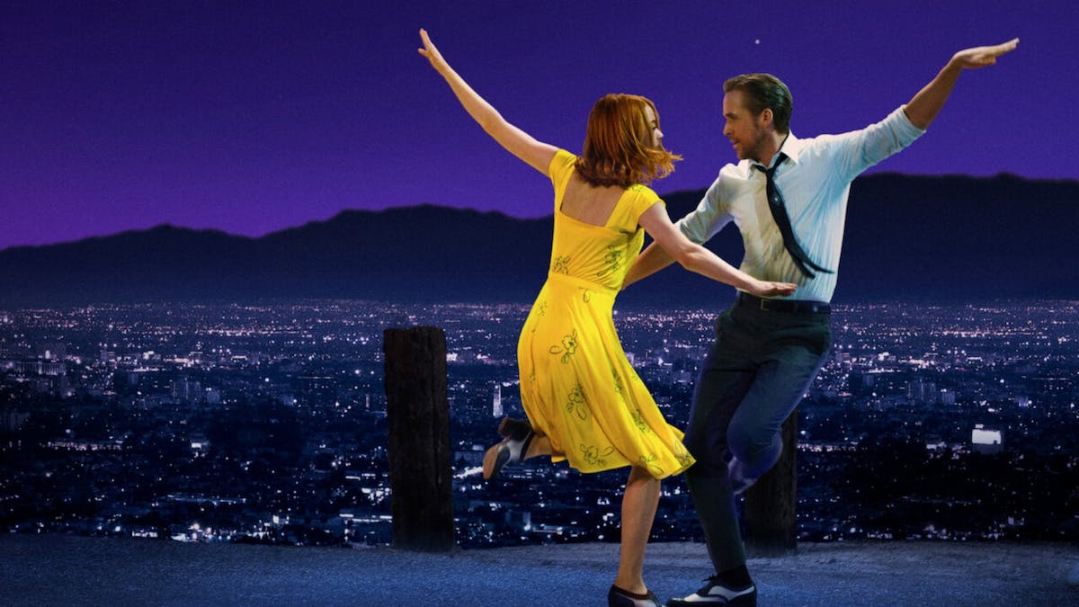man and woman dancing infront of LA skyline