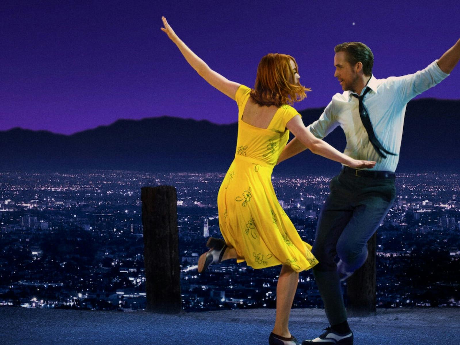 man and woman dancing infront of LA skyline man and woman dancing infront of LA skyline