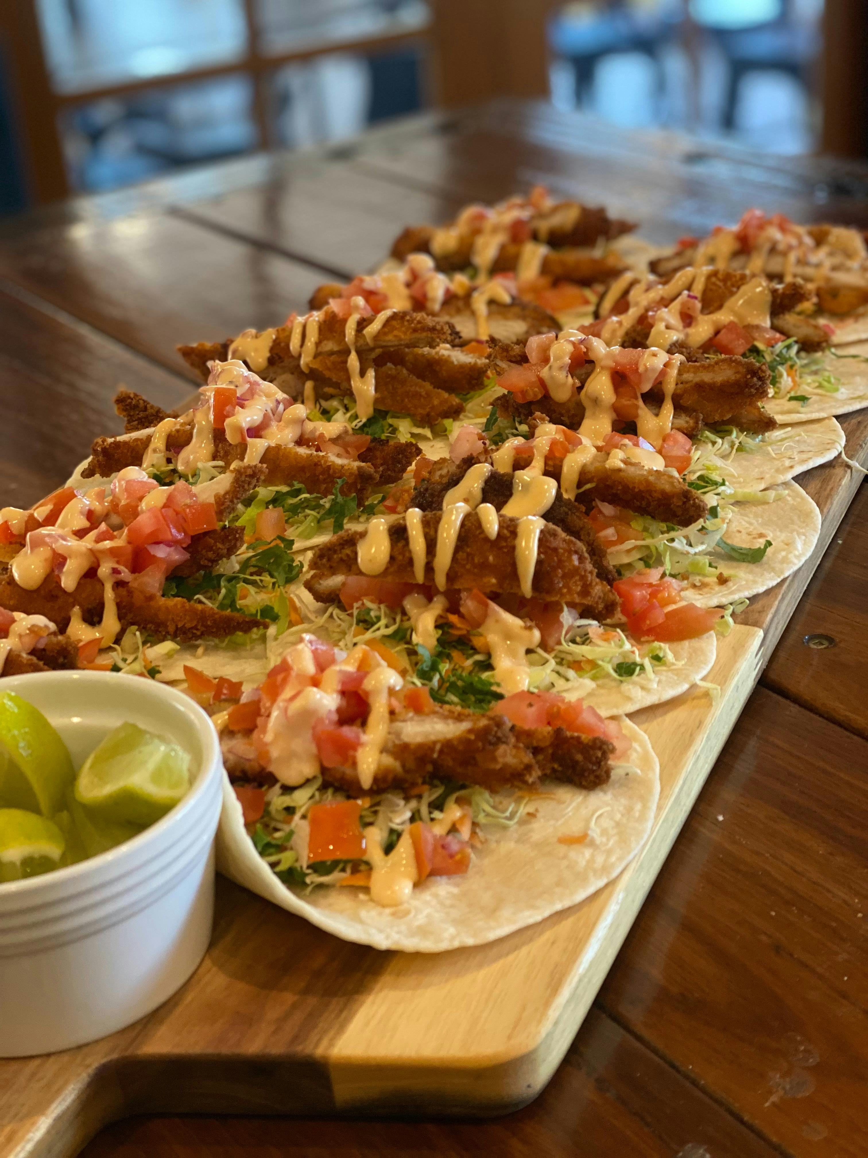 A close up of a plate of tacos