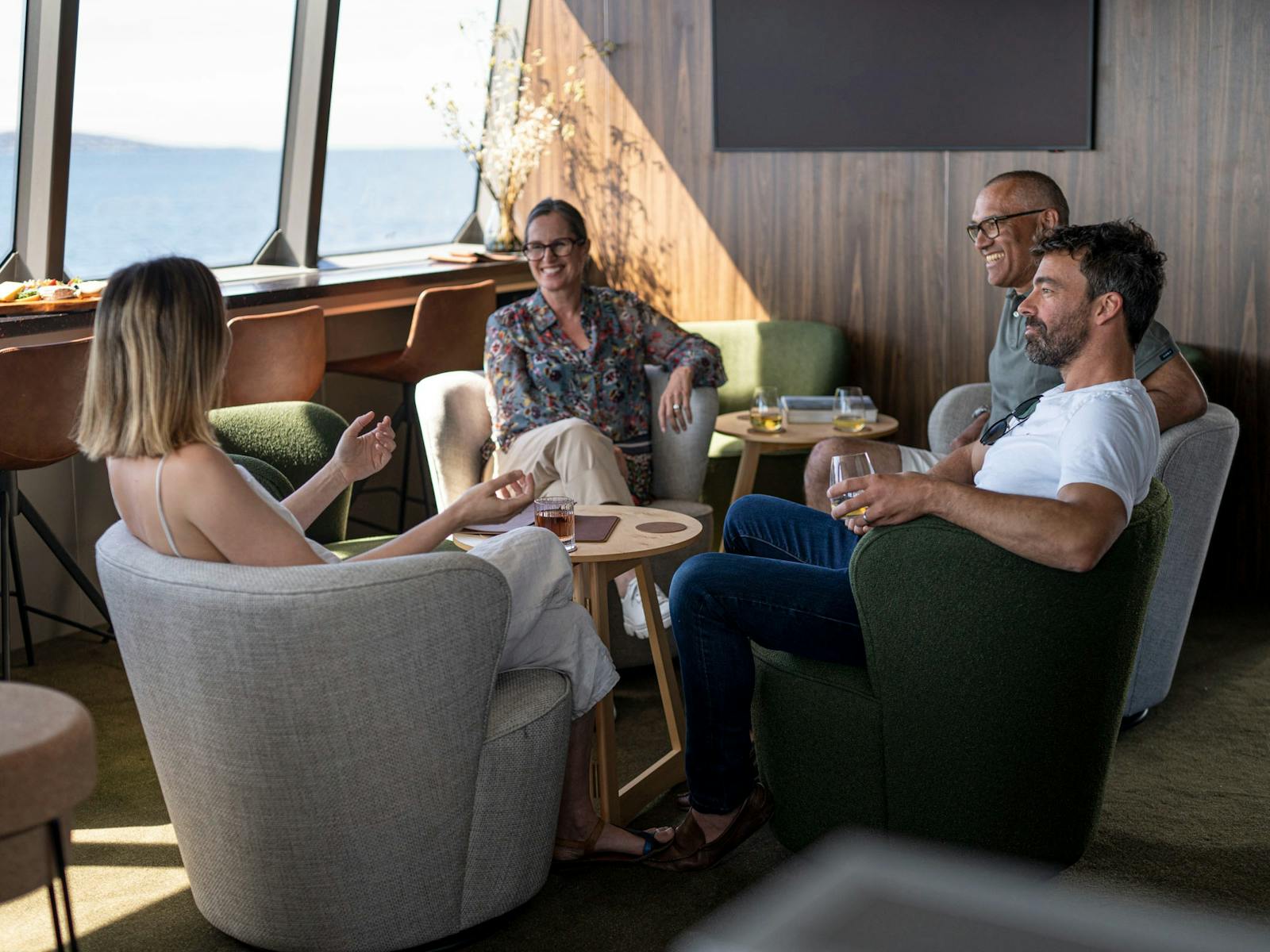Guests relaxing in expedition vessel Odalisque's Wheelhouse Lounge & Bar