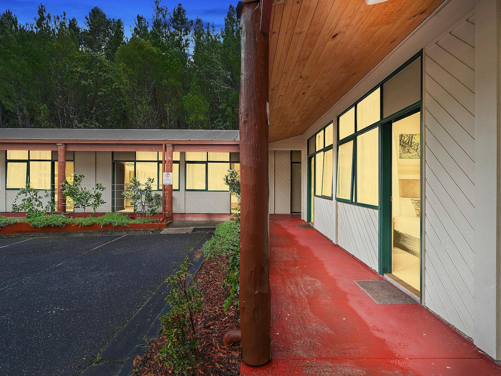 Rooms are warm and inviting surrounded by rhododendron shrubs