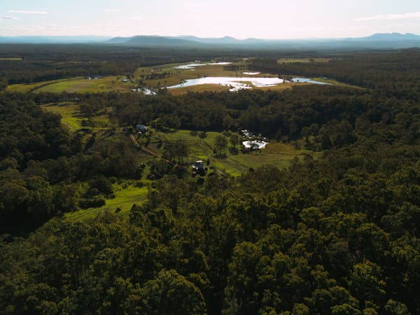 Bird's-eye view shots of the area with mountains in the distance.
