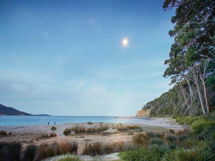 2 people fishing on the waterline near Depot Beach cabins, located on the NSW South Coast. Photo: Ni