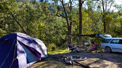 A tent and car at Deua River campgrounds, Deua National Park. Photo: Lucas Boyd/DPIE