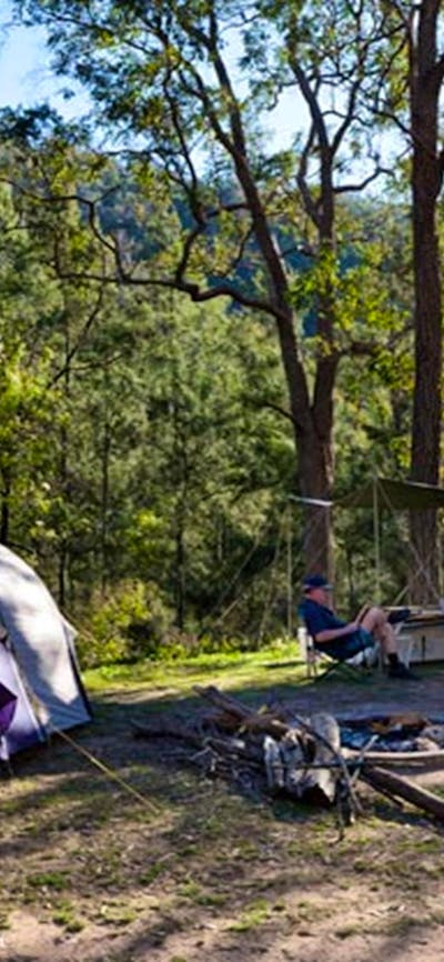 A tent and car at Deua River campgrounds, Deua National Park. Photo: Lucas Boyd/DPIE