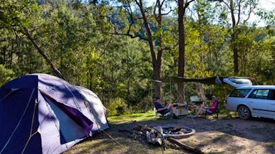 A tent and car at Deua River campgrounds, Deua National Park. Photo: Lucas Boyd/DPIE