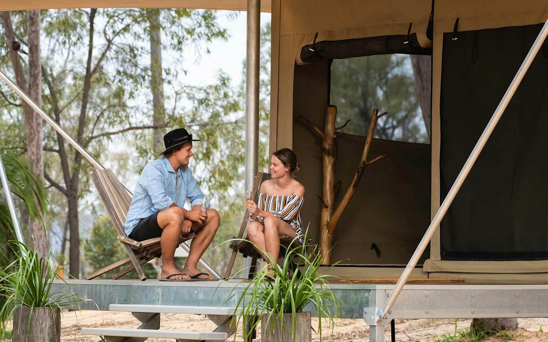Two people relaxing in a large tent at Wallaroo Outback Retreat