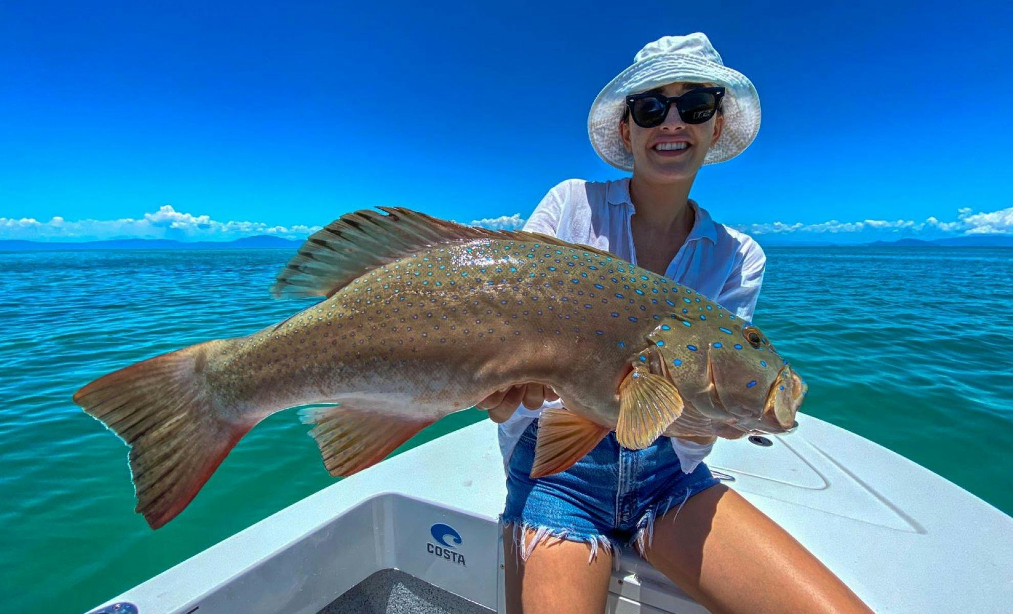 Woman with Fish Catch